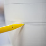 Rhian Malin decorating a mandala bottle in her workshop 2019